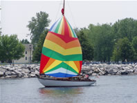 Boat with rainbow sail